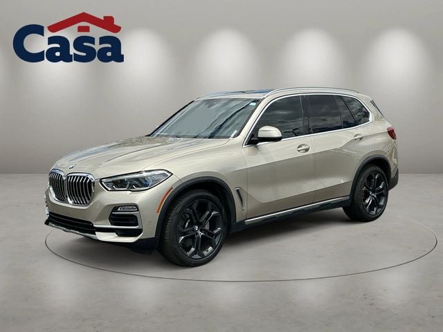 2019 BMW X5 xDrive40i in Sunstone Metallic — front three-quarter view